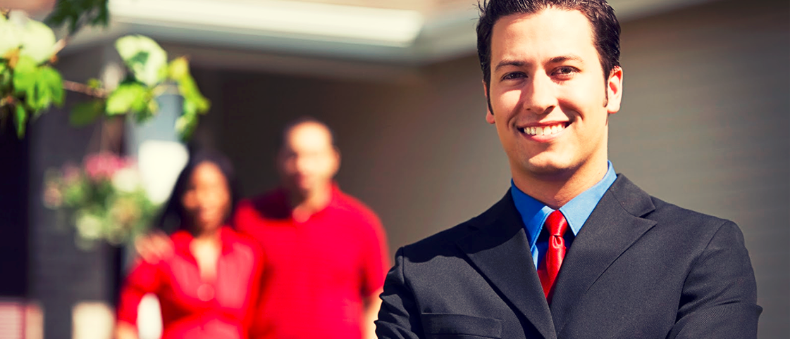 Confident Real Estate Agent with Home buyers
